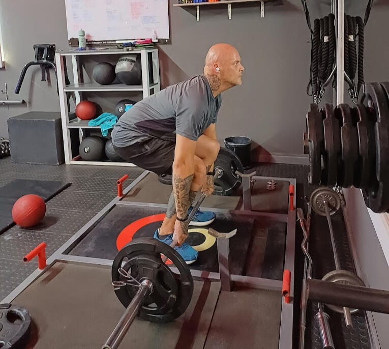 Man training at CoreOne gym mulbarton in Johannesburg South.